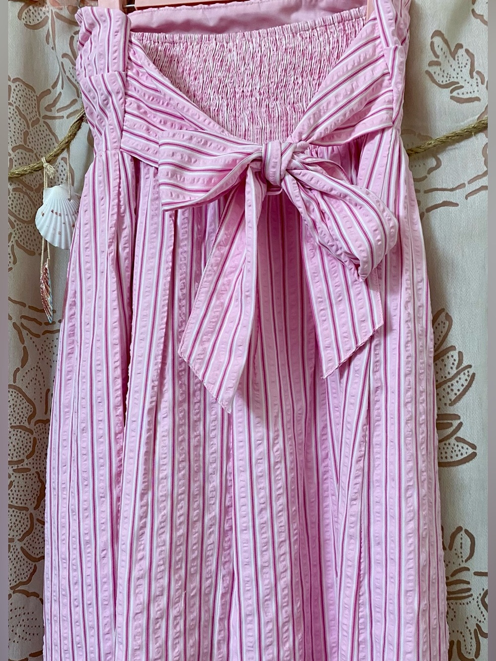 Pink striped strapless mini dress, bow back